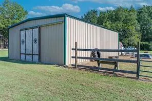 a view of a back yard with a bench