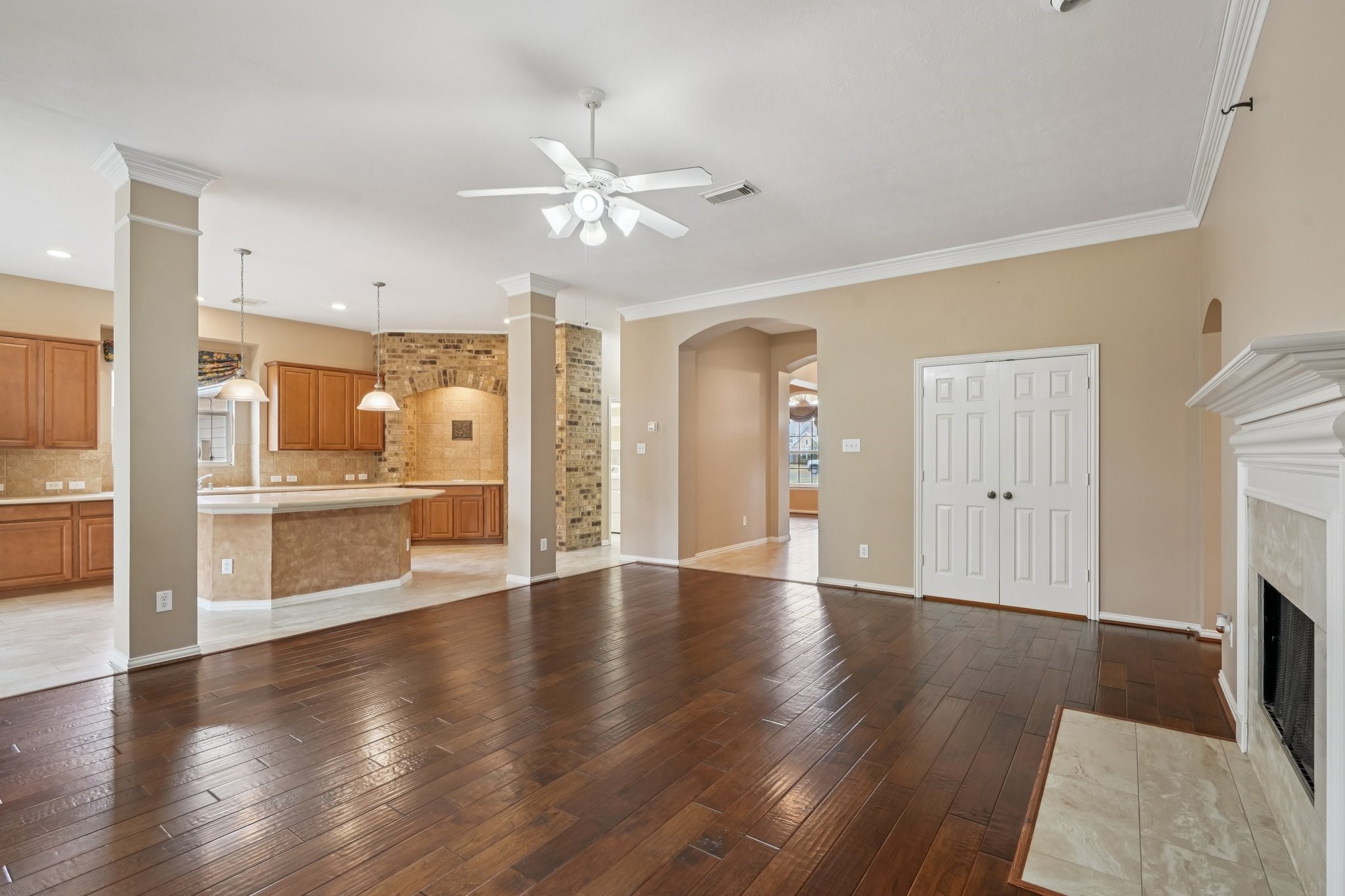 31810 Tree Farm Lane Fulshear, TX 77441 - Photo 1 of 49 Spacious family room with beautiful hardwood floors, open to kitchen and breakfast nook.
