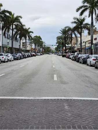 a view of road with a cars park