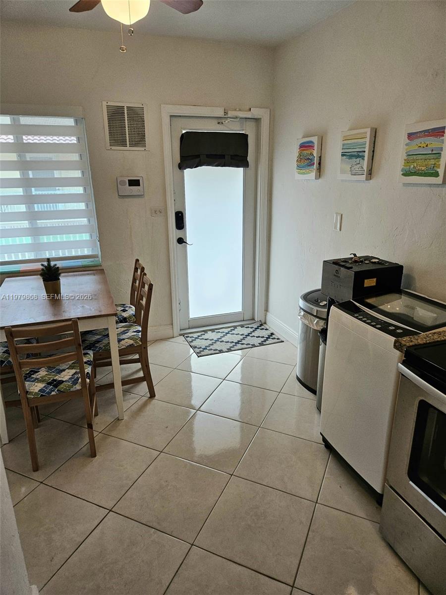 7400 Harding Avenue, Unit 22 Miami Beach, FL 33141 - Photo 7 of 26 a room with furniture a rug and white walls