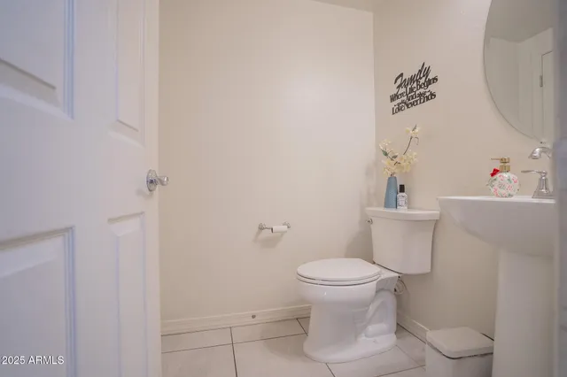a bathroom with a toilet and a sink