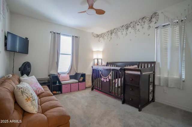 a living room with furniture and a window