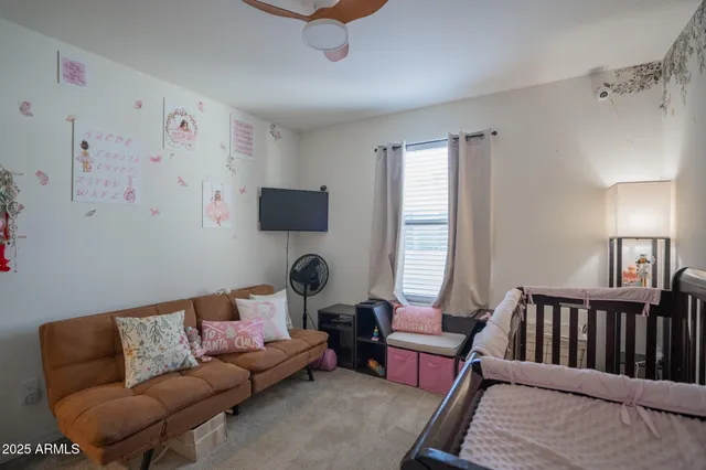 a living room with furniture and a window