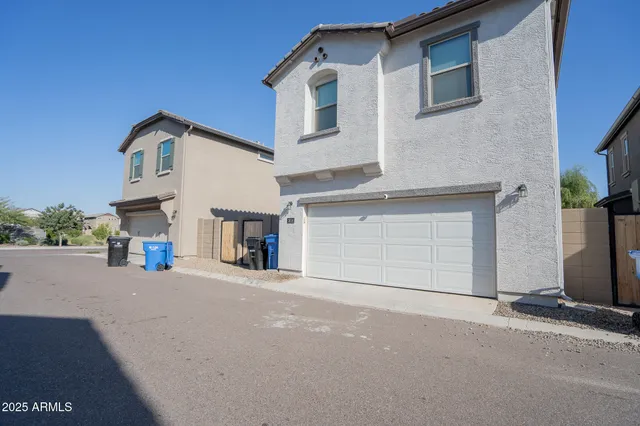 a view of a house with a street