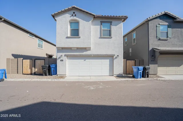 a view of a car parked in front of a house