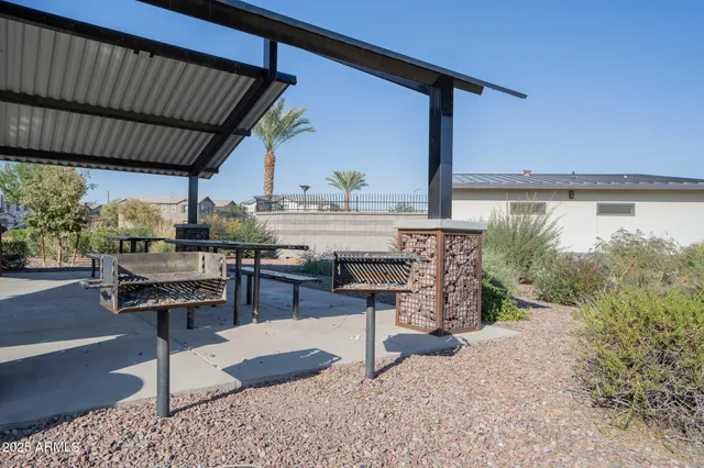 a view of a chairs and table in the patio