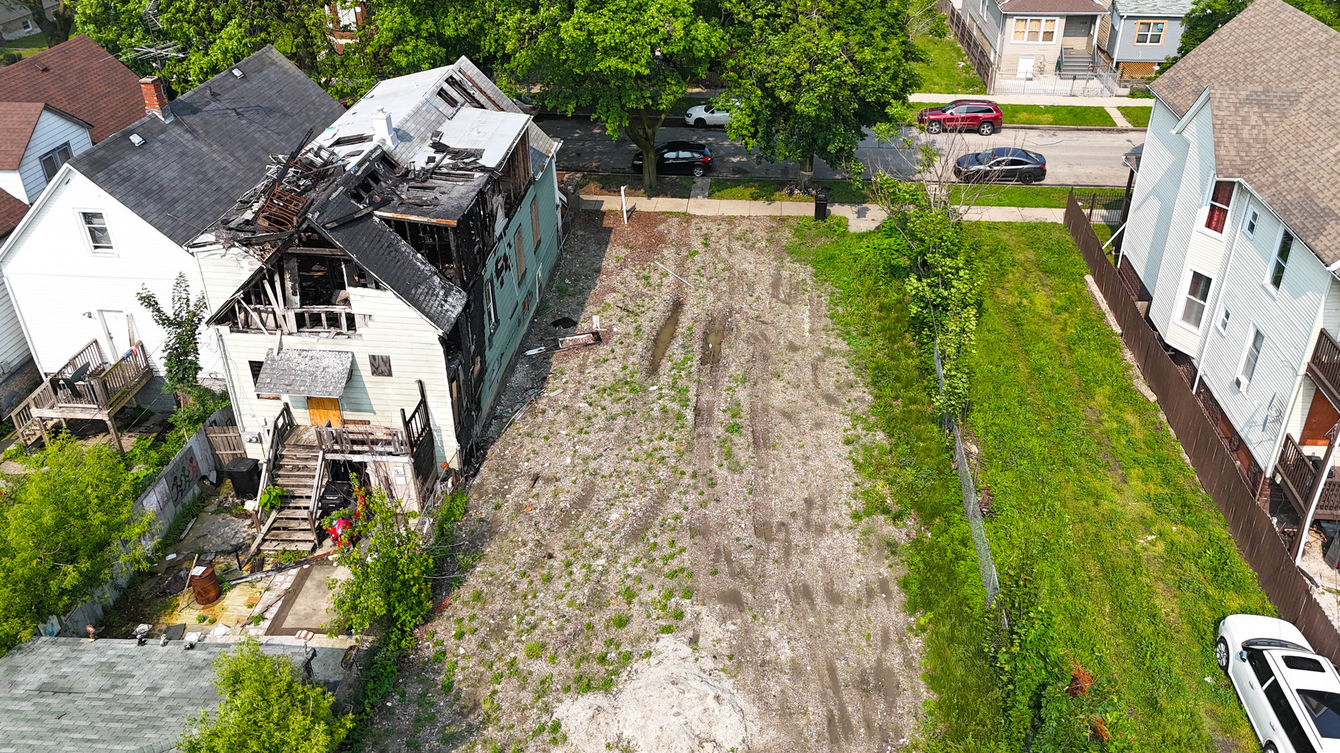 a aerial view of a house with a yard