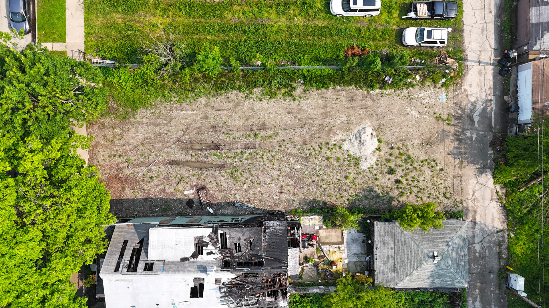 5935 South Carpenter Street Chicago, IL 60621 - Photo 2 of 6 an aerial view of a house with a yard
