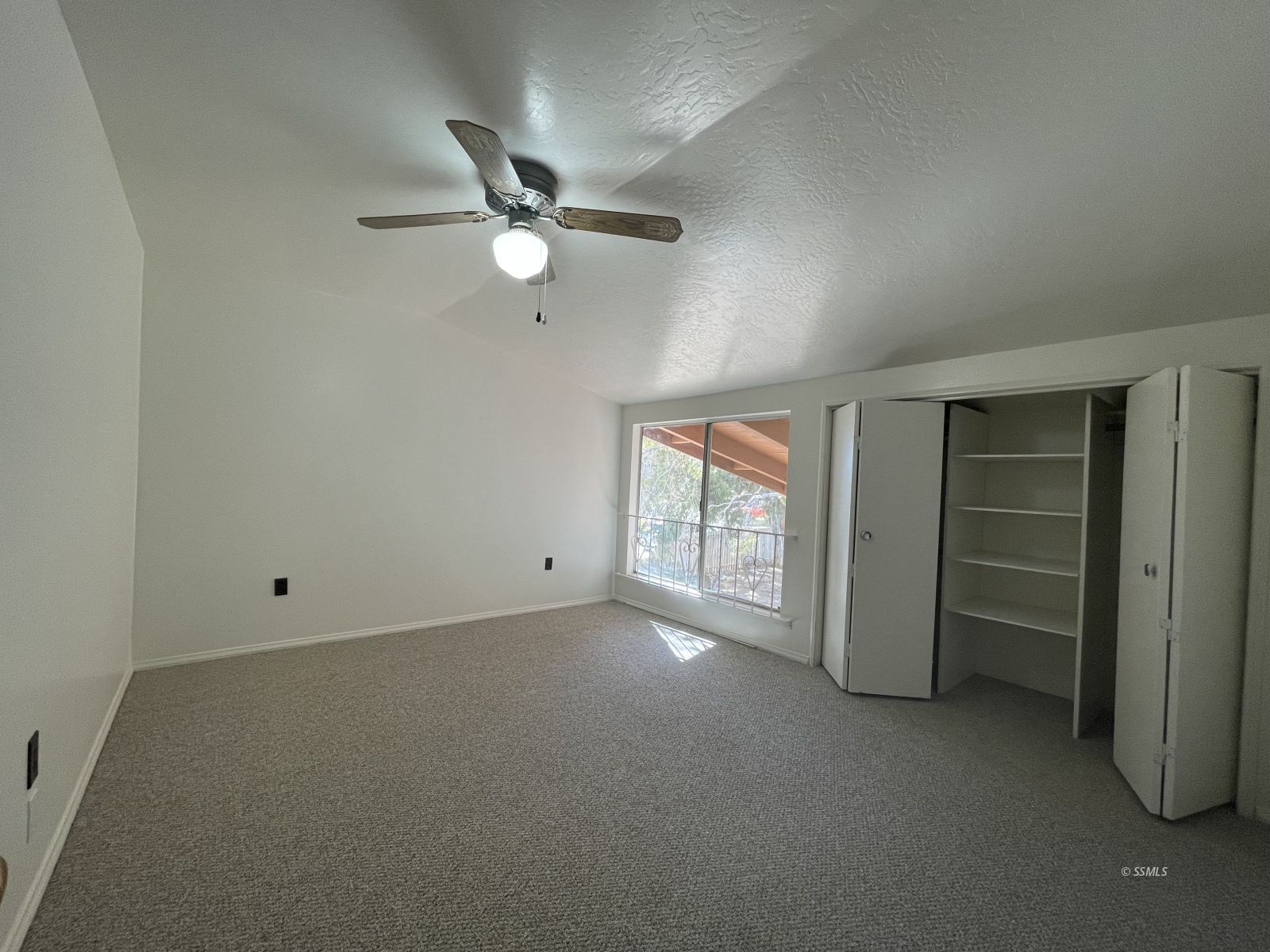 1562 West Reeves Avenue Ridgecrest, CA 93555 - Photo 16 of 45 an empty room with closet and windows