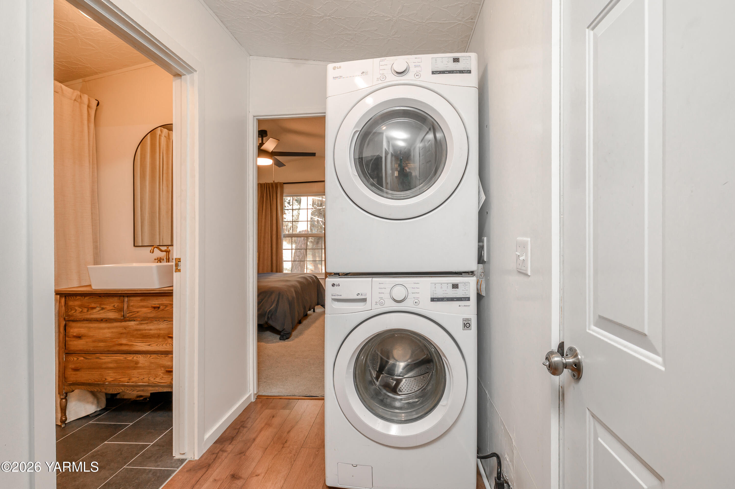 6371 Fork Road North Yakima, WA 98903 - Photo 12 of 19 a view of a hallway with washer and dryer