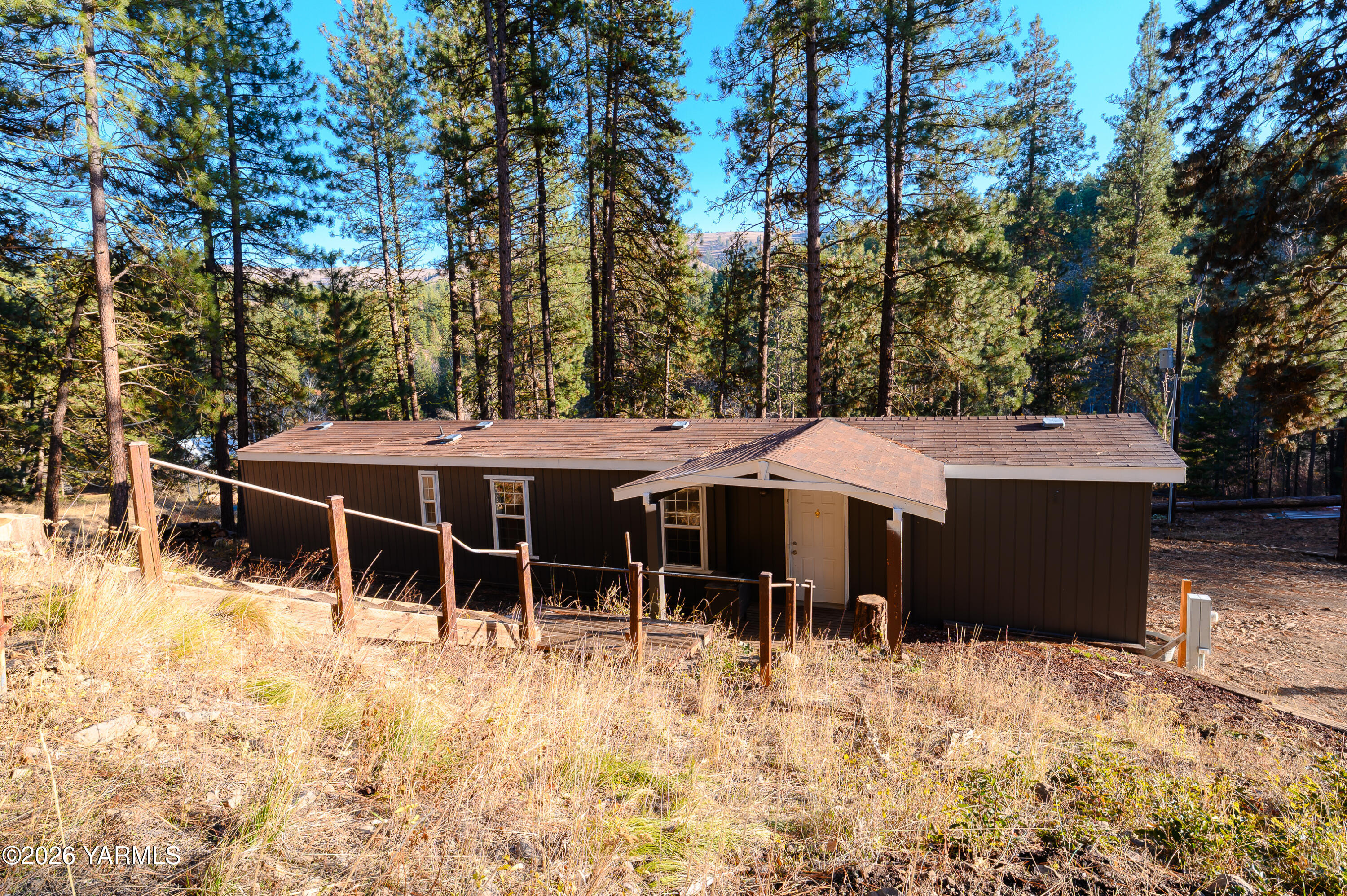 6371 Fork Road North Yakima, WA 98903 - Photo 16 of 19 a table and chair under the tree