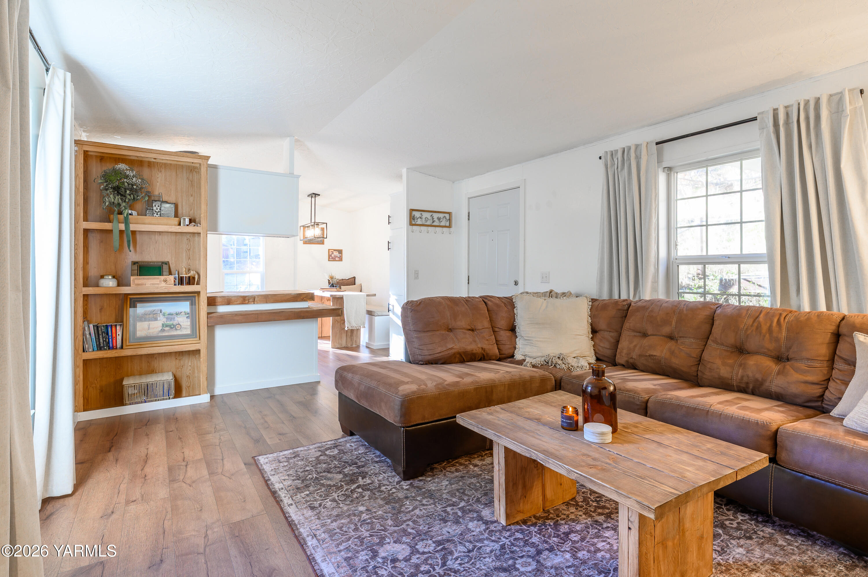 6371 Fork Road North Yakima, WA 98903 - Photo 2 of 19 a living room with furniture and a wooden floor