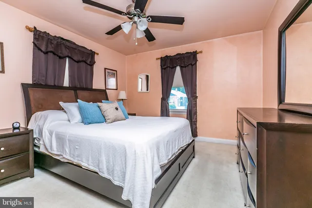 a bedroom with bed and window