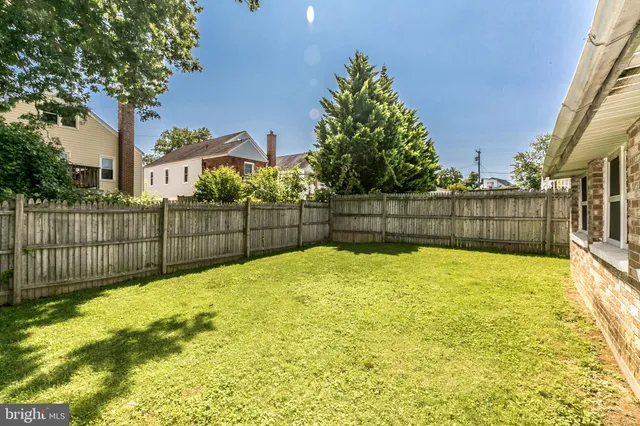 a front view of a house with a garden and deck