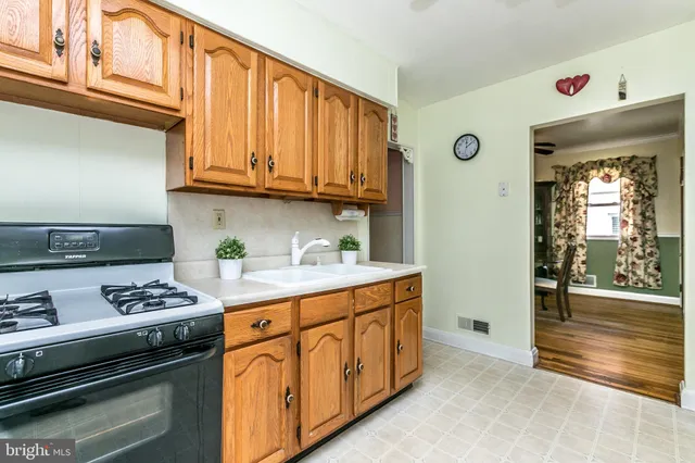 a kitchen with stainless steel appliances granite countertop a stove and a cabinets