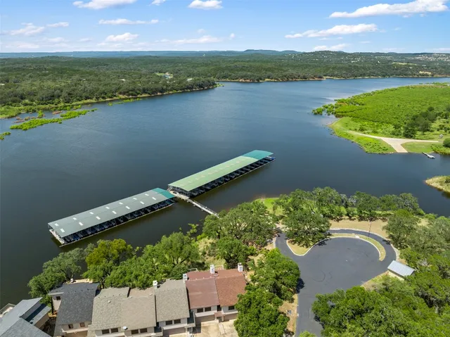 an aerial view of a house with a lake view