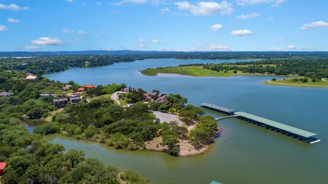an aerial view of a golf course with chairs