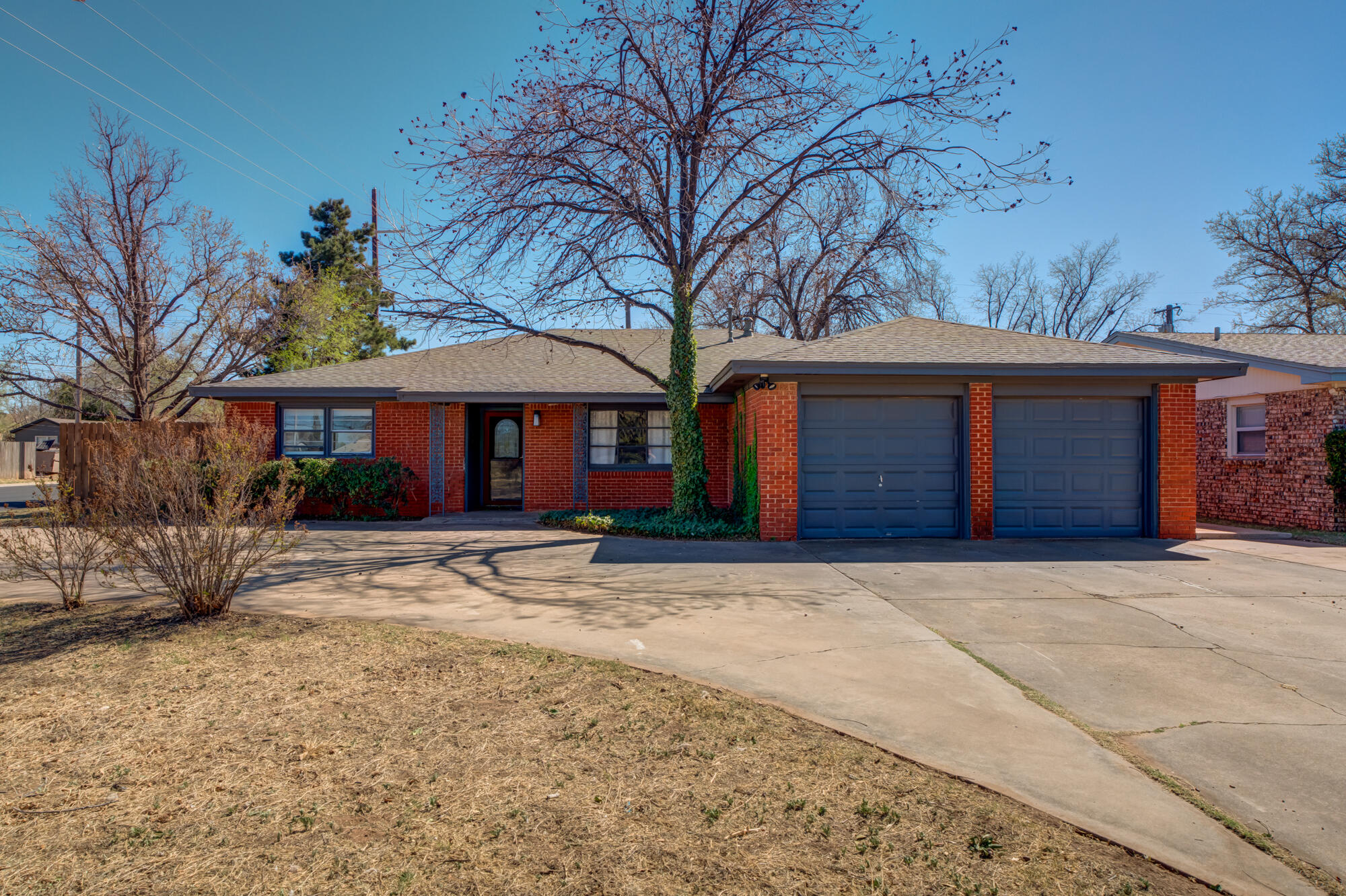 2101 64th Street Lubbock, TX 79412 - Photo 6 of 30 a front view of a house with yard