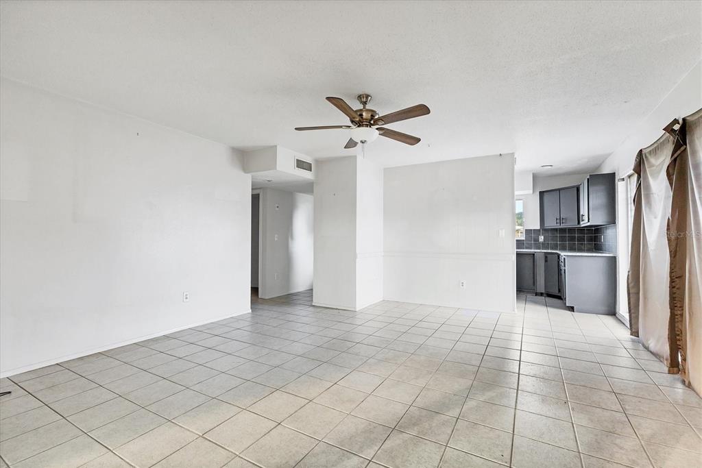 2529 Ednor Street Port Charlotte, FL 33952 - Photo 16 of 23 a view of a kitchen with a sink and a refrigerator