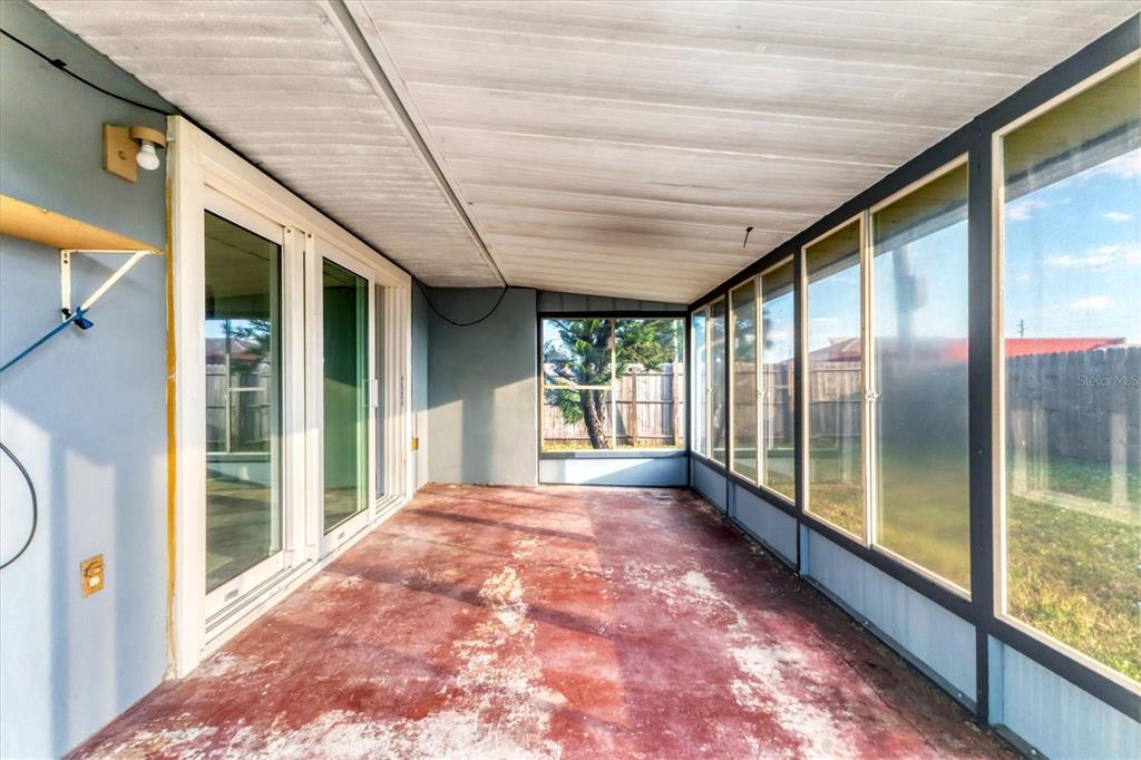 2529 Ednor Street Port Charlotte, FL 33952 - Photo 4 of 23 a bathroom with a large window and a shower