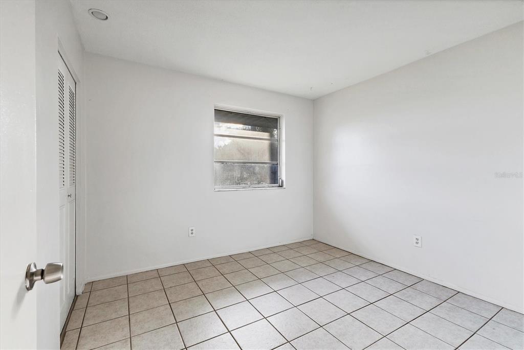 2529 Ednor Street Port Charlotte, FL 33952 - Photo 6 of 23 an empty room with a window