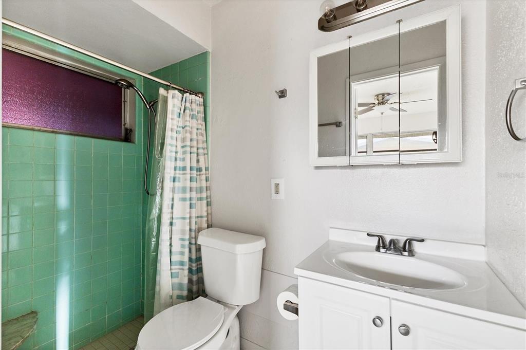 2529 Ednor Street Port Charlotte, FL 33952 - Photo 7 of 23 a bathroom with a granite countertop toilet sink and mirror