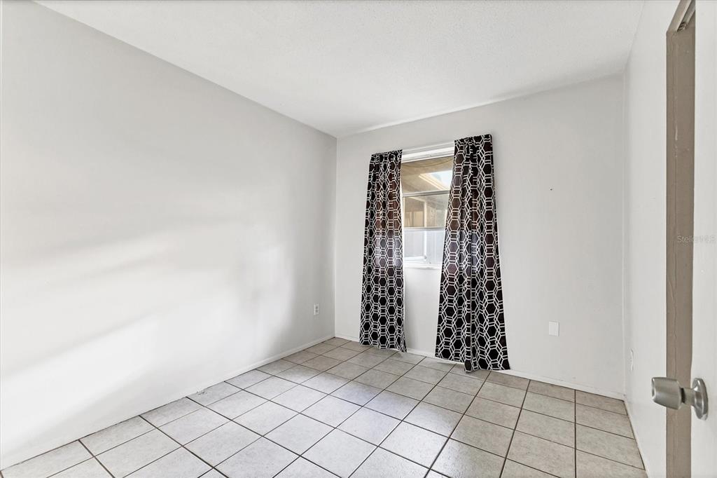 2529 Ednor Street Port Charlotte, FL 33952 - Photo 8 of 23 a view of an empty room with a window