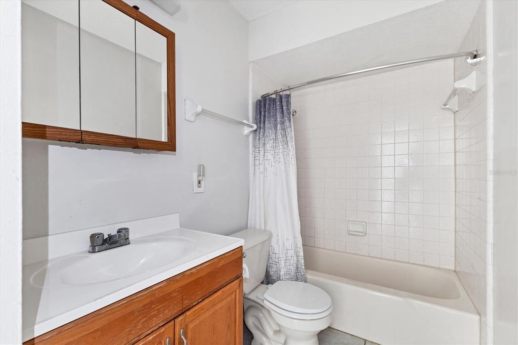 2529 Ednor Street Port Charlotte, FL 33952 - Photo 9 of 23 a bathroom with a sink a toilet and shower