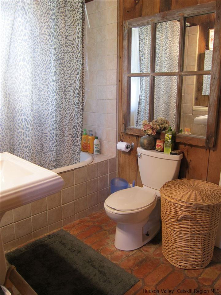72 Little Deer Road Mount Tremper, NY 12457 - Photo 15 of 21 a bathroom with a sink toilet and window