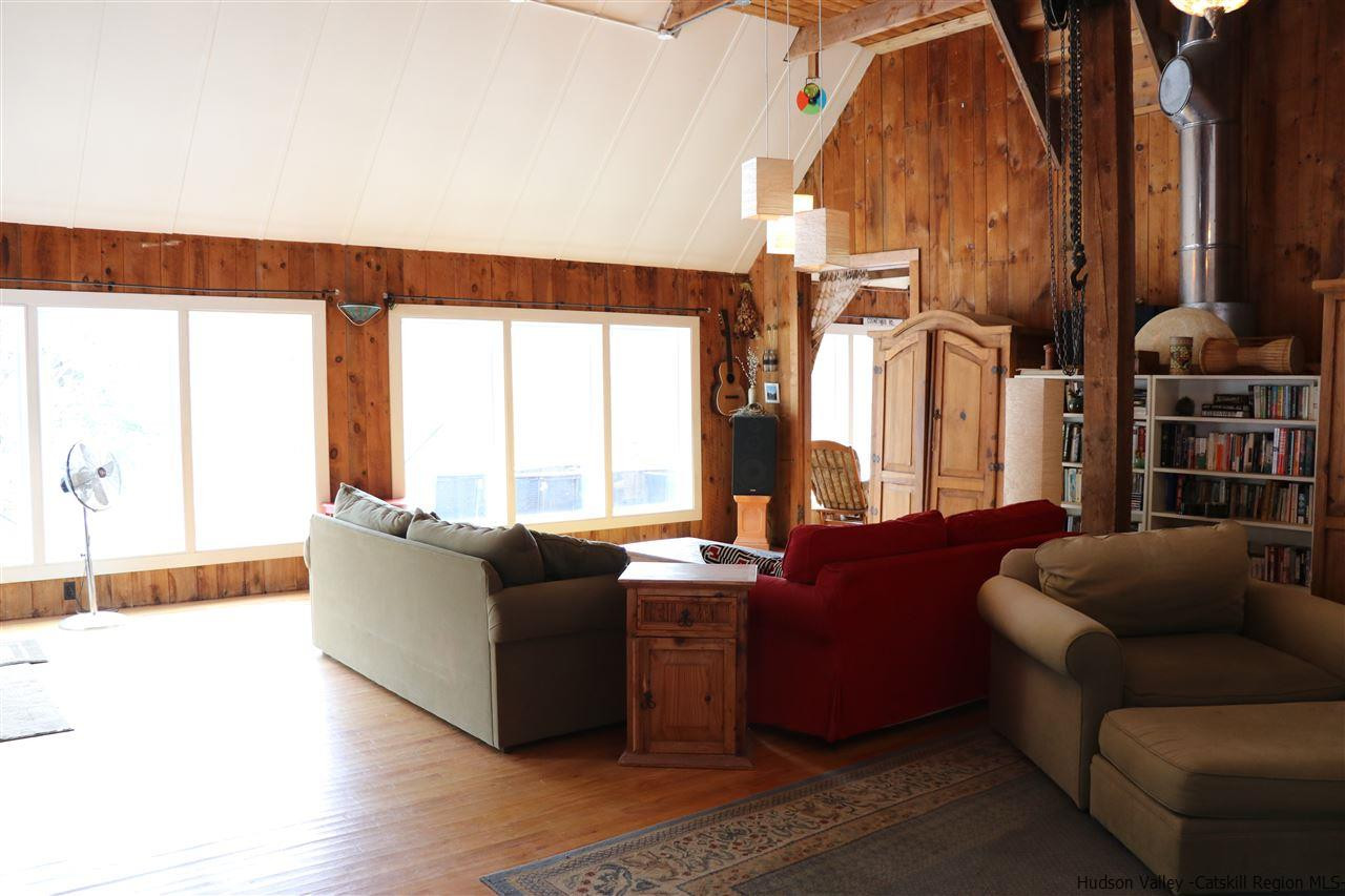 72 Little Deer Road Mount Tremper, NY 12457 - Photo 18 of 21 a living room with furniture and a large window