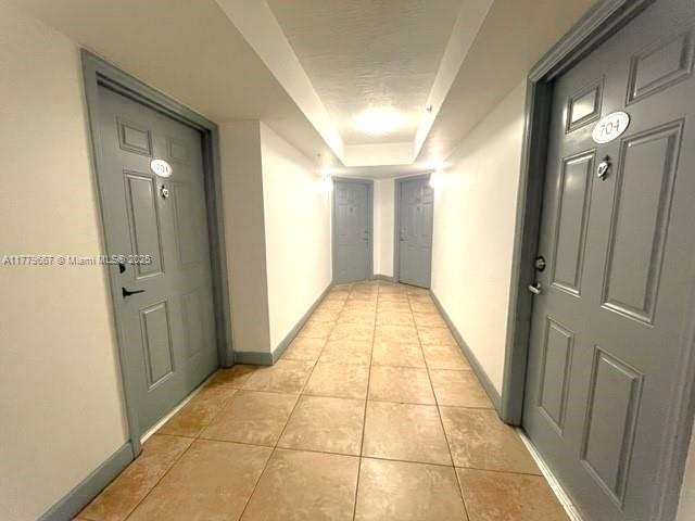 102 Southwest 6th Avenue, Unit 701 Miami, FL 33130 - Photo 20 of 25 a view of hallway with a bathroom and a mirror
