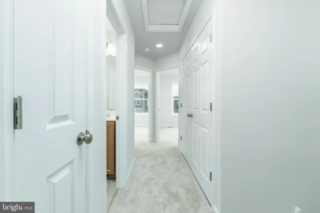 a view of a hallway with a white walls