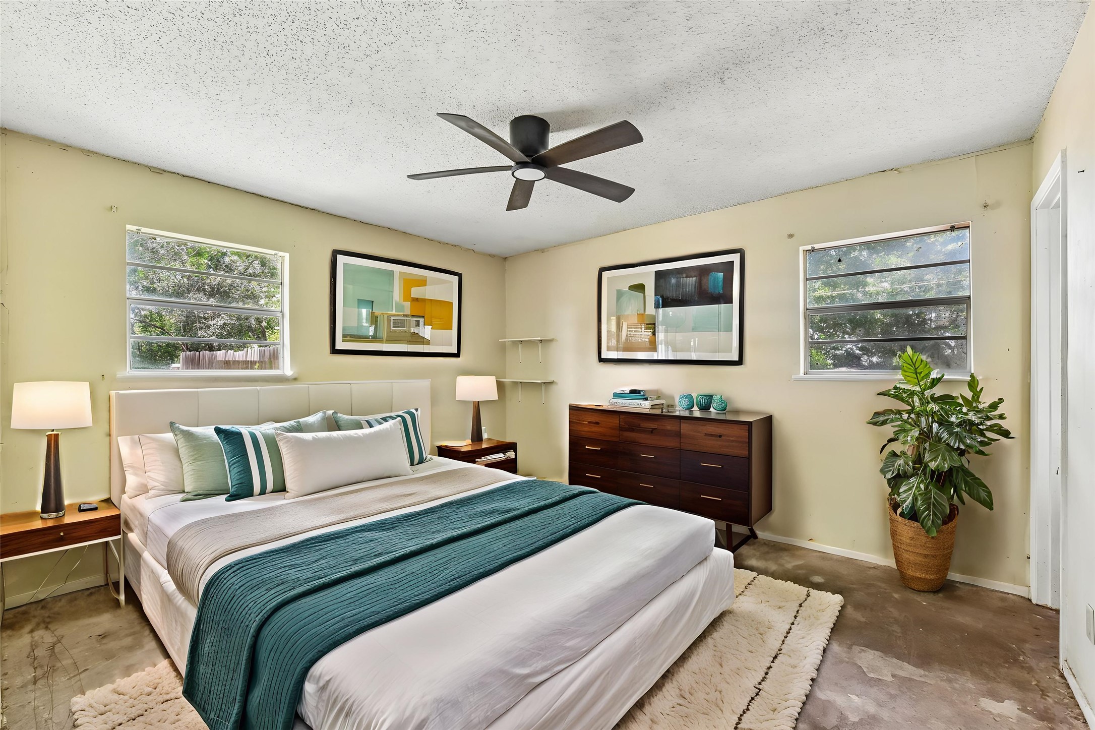 1111 Silent Valley Road Lockhart, TX 78644 - Photo 4 of 14 The generously proportioned bedroom features a ceiling fan, ensuring comfort and air circulation.
