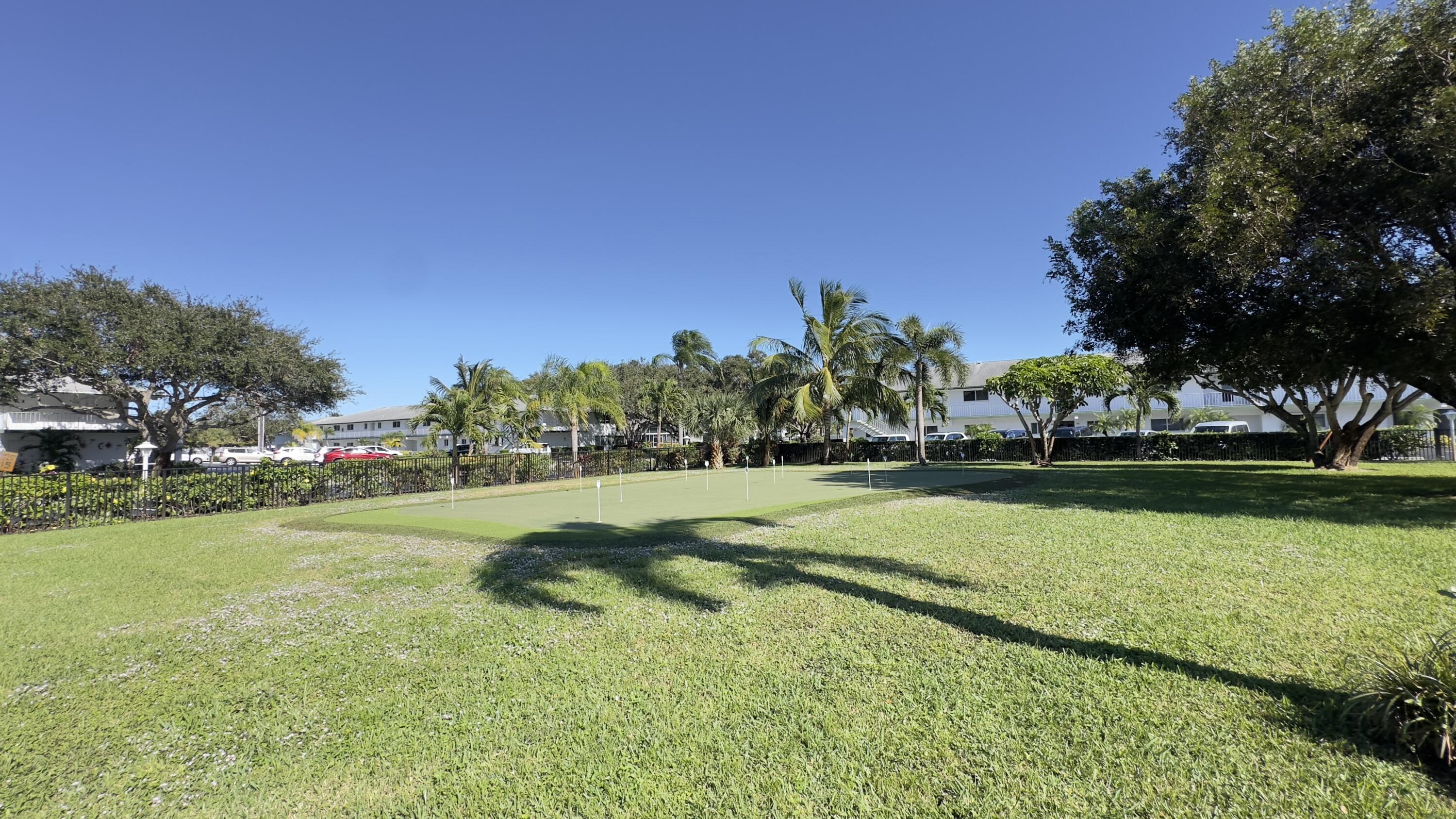 3 Garden Street, Unit 105K Tequesta, FL 33469 - Photo 21 of 41 a view of a park with large trees