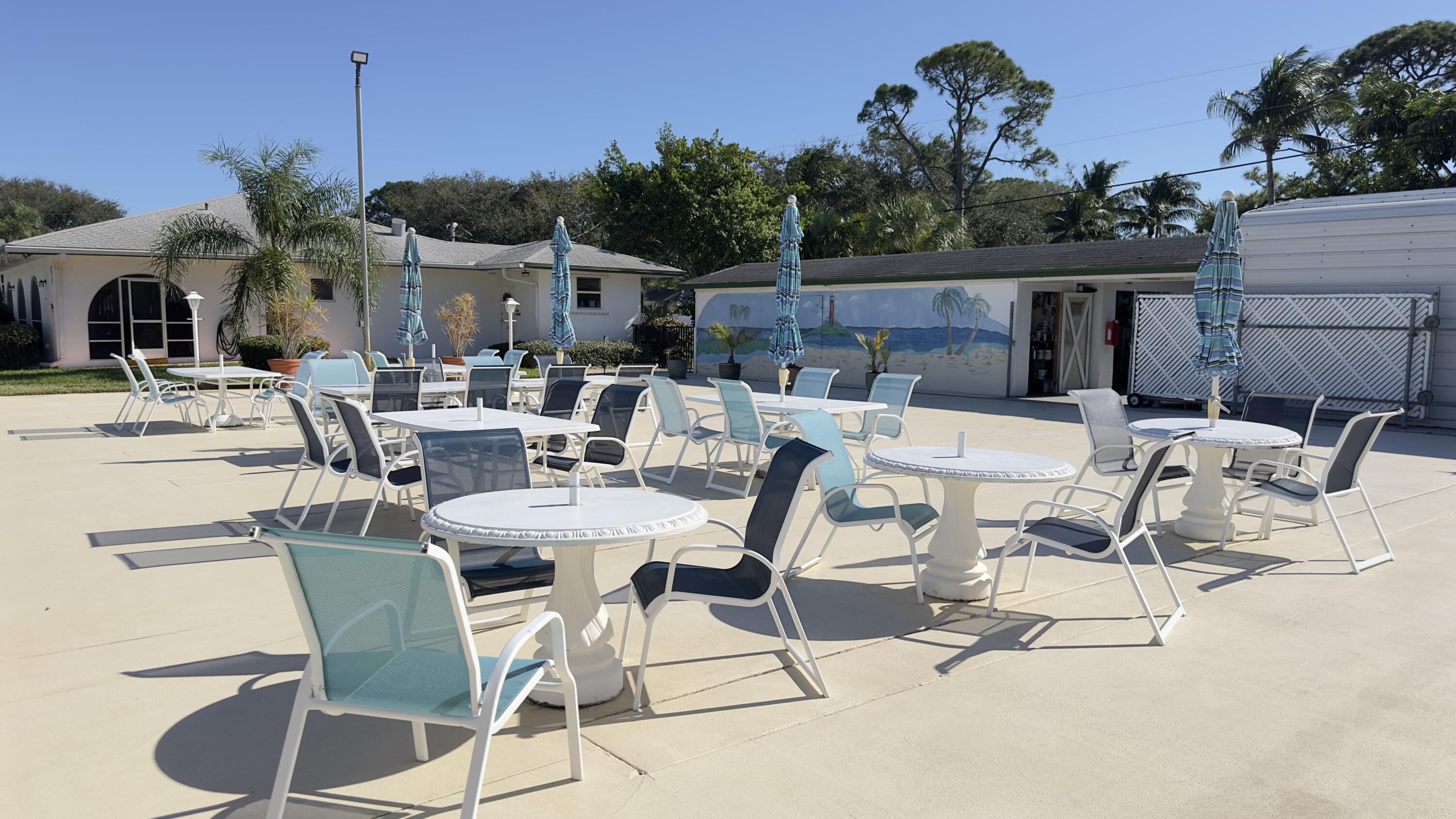 3 Garden Street, Unit 105K Tequesta, FL 33469 - Photo 23 of 41 a view of an outside dining space with furniture