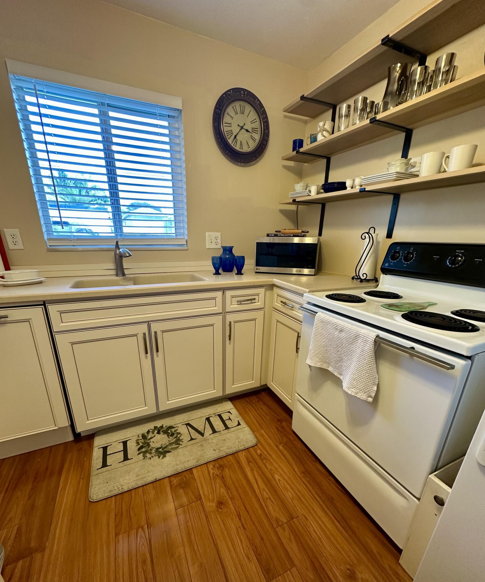 3 Garden Street, Unit 105K Tequesta, FL 33469 - Photo 34 of 41 a kitchen with appliances cabinets and a table