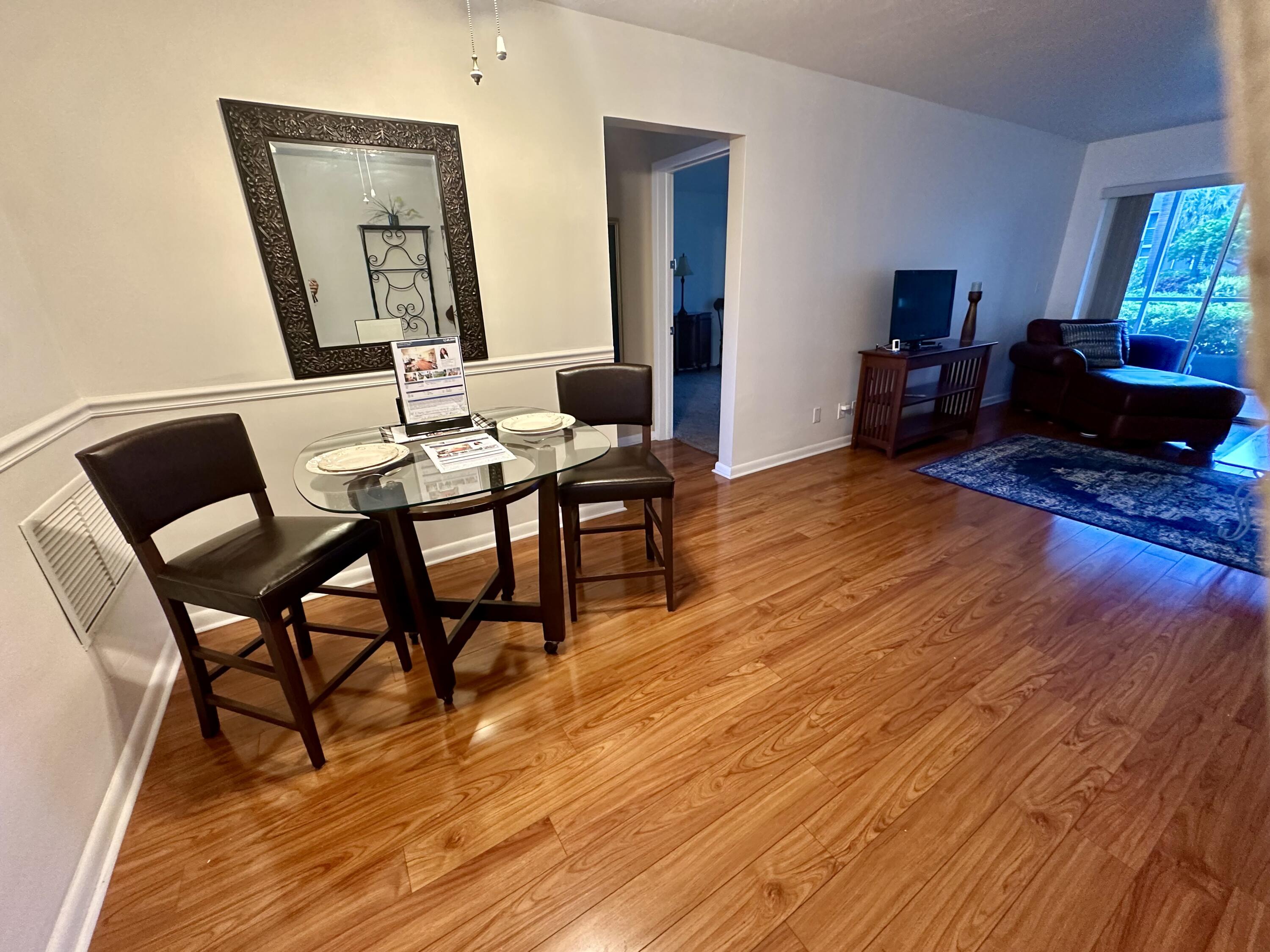3 Garden Street, Unit 105K Tequesta, FL 33469 - Photo 40 of 41 a view of a livingroom with furniture and a wooden floor