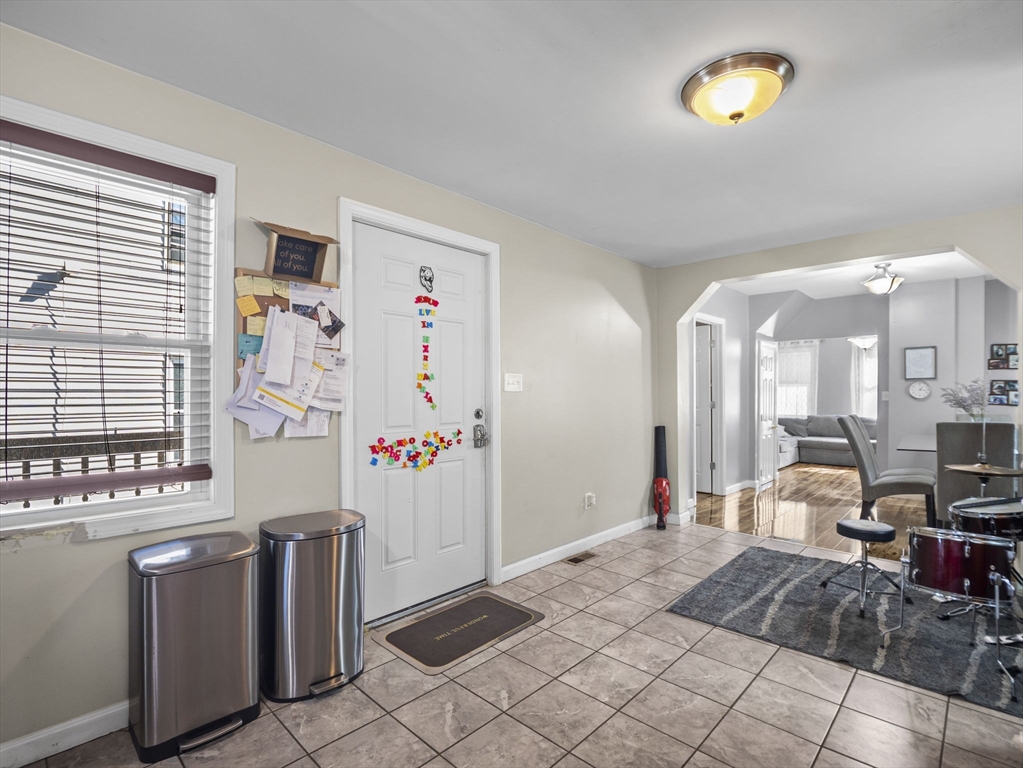 85 B Street Lowell, MA 01851 - Photo 12 of 42 a view of a livingroom with furniture and a window