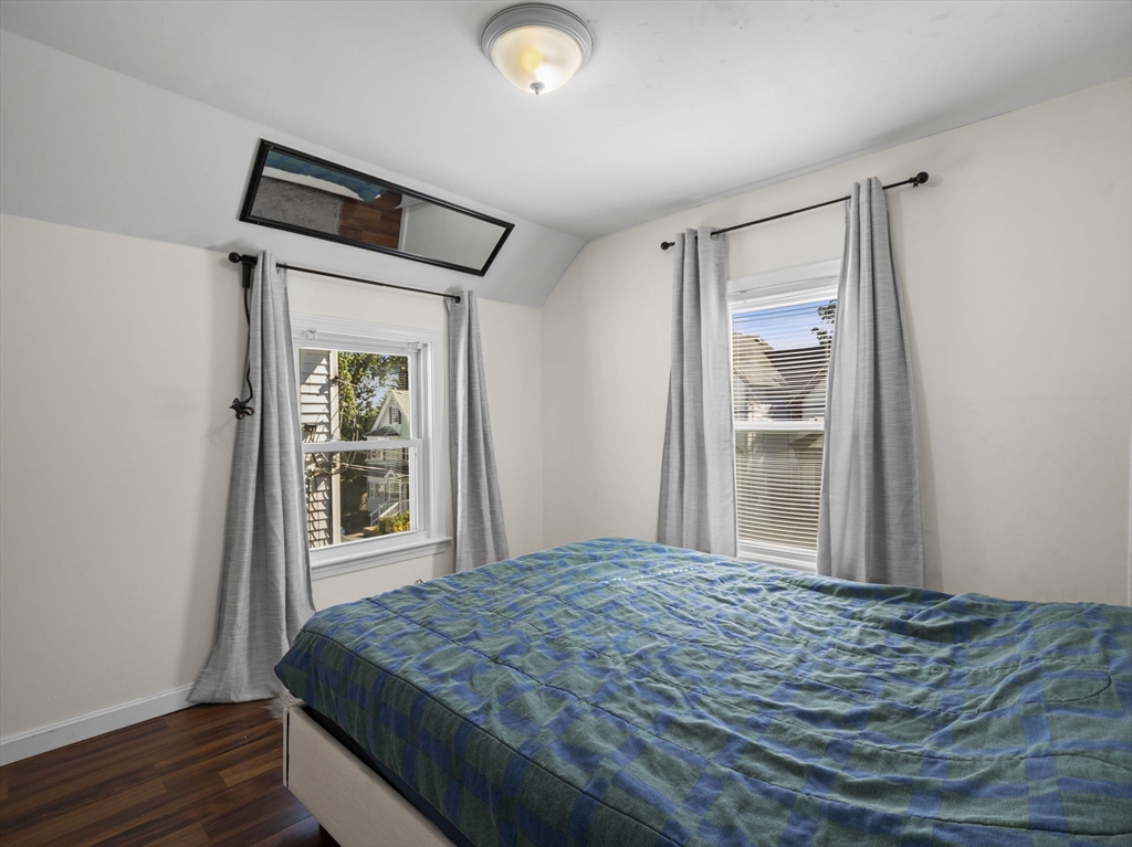 85 B Street Lowell, MA 01851 - Photo 19 of 42 a bedroom with a bed and a window