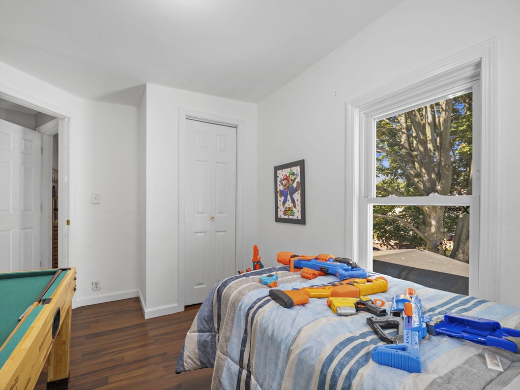 85 B Street Lowell, MA 01851 - Photo 25 of 42 a room with furniture and a wooden floor