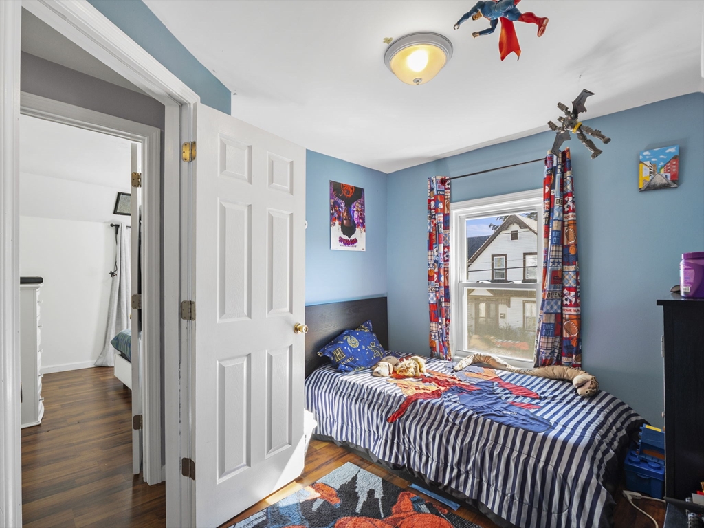 85 B Street Lowell, MA 01851 - Photo 27 of 42 a bedroom with a bed and a window