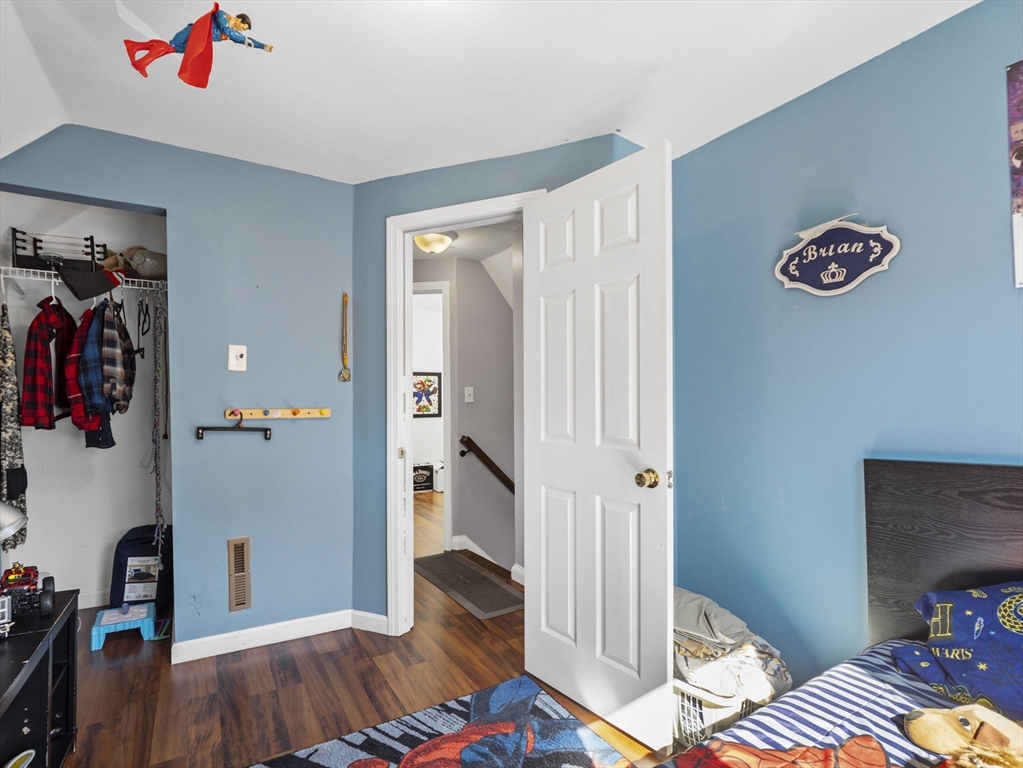 85 B Street Lowell, MA 01851 - Photo 28 of 42 a view of bedroom with a bed and a dresser