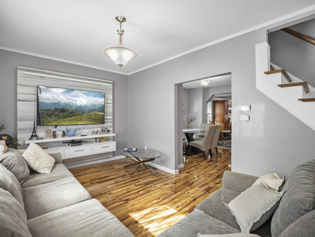 85 B Street Lowell, MA 01851 - Photo 3 of 42 a living room with furniture and a flat screen tv