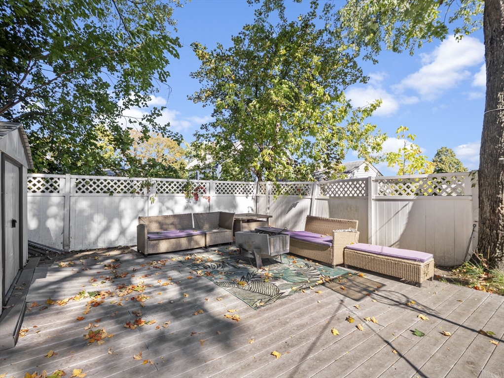 85 B Street Lowell, MA 01851 - Photo 36 of 42 a backyard of a house with table and chairs