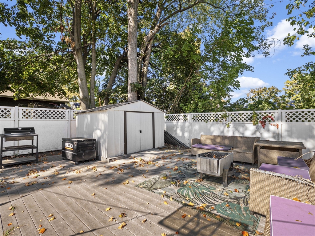 85 B Street Lowell, MA 01851 - Photo 37 of 42 a roof view of a house with backyard stove and sitting area