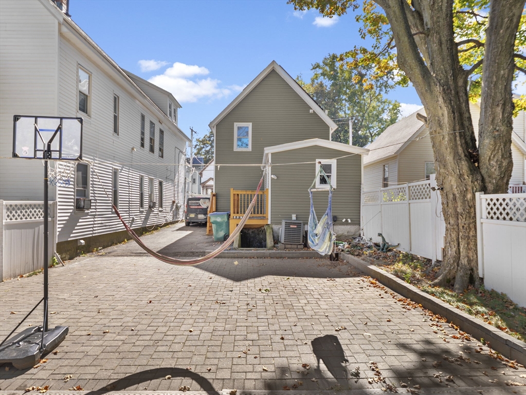 85 B Street Lowell, MA 01851 - Photo 40 of 42 a front view of a house with patio