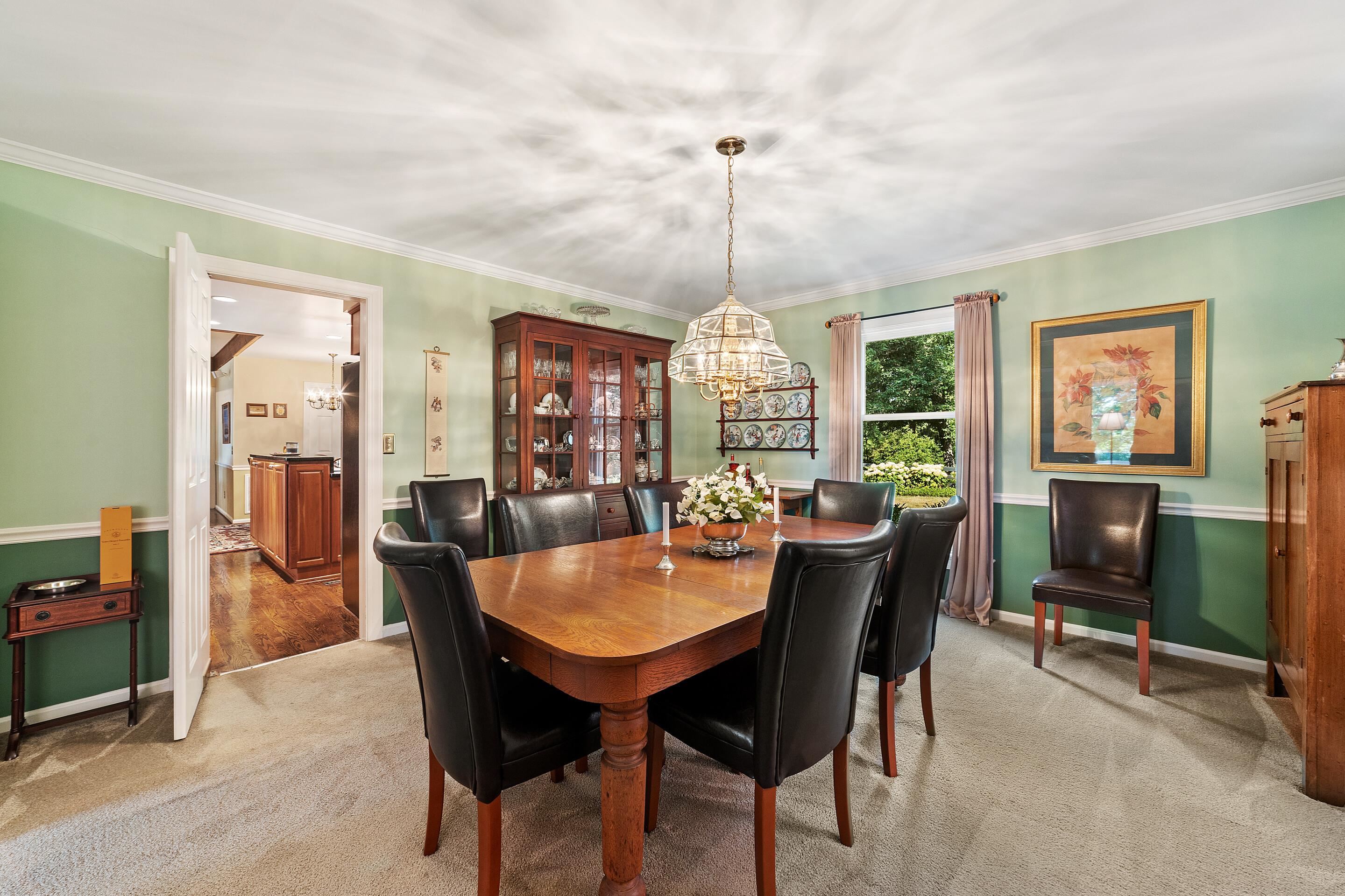 60 Roman Ridge Road Mount Sidney, VA 24467 - Photo 17 of 75 a dining room with furniture a chandelier and wooden floor