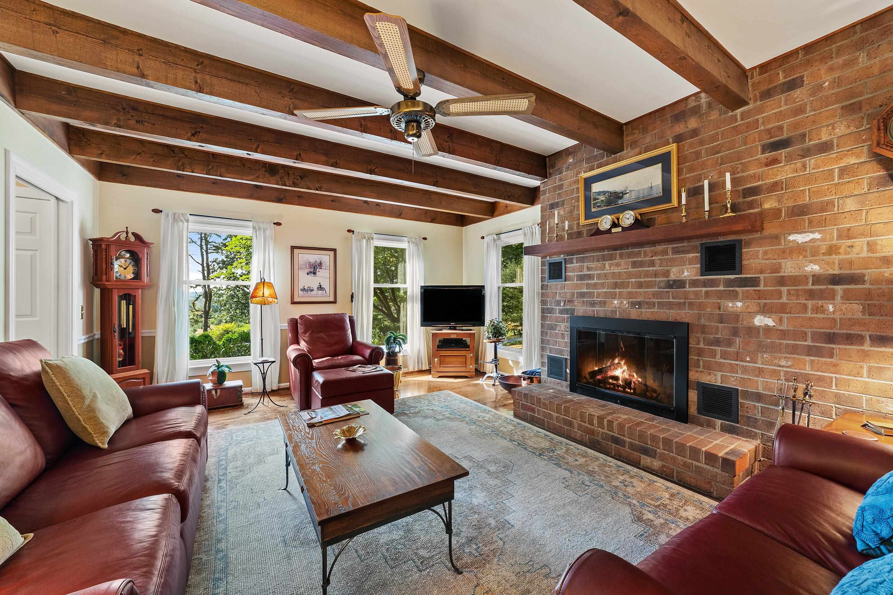 60 Roman Ridge Road Mount Sidney, VA 24467 - Photo 24 of 75 a living room with furniture and a fireplace