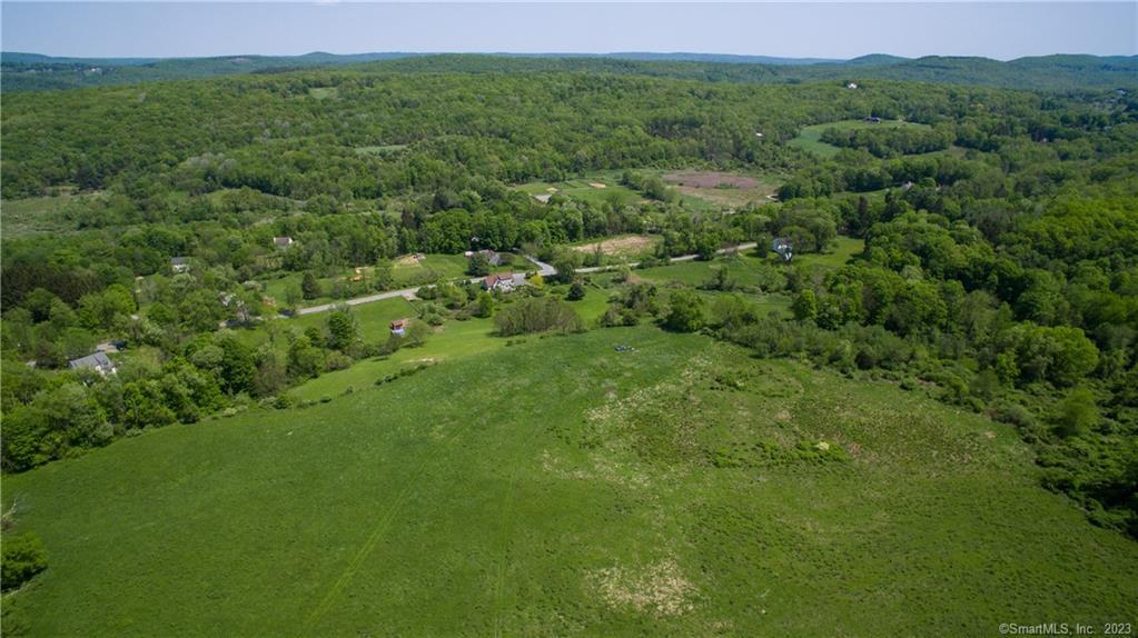 0 Anderson Road Sherman, CT 06784 - Photo 3 of 5 a view of a green field with lots of bushes