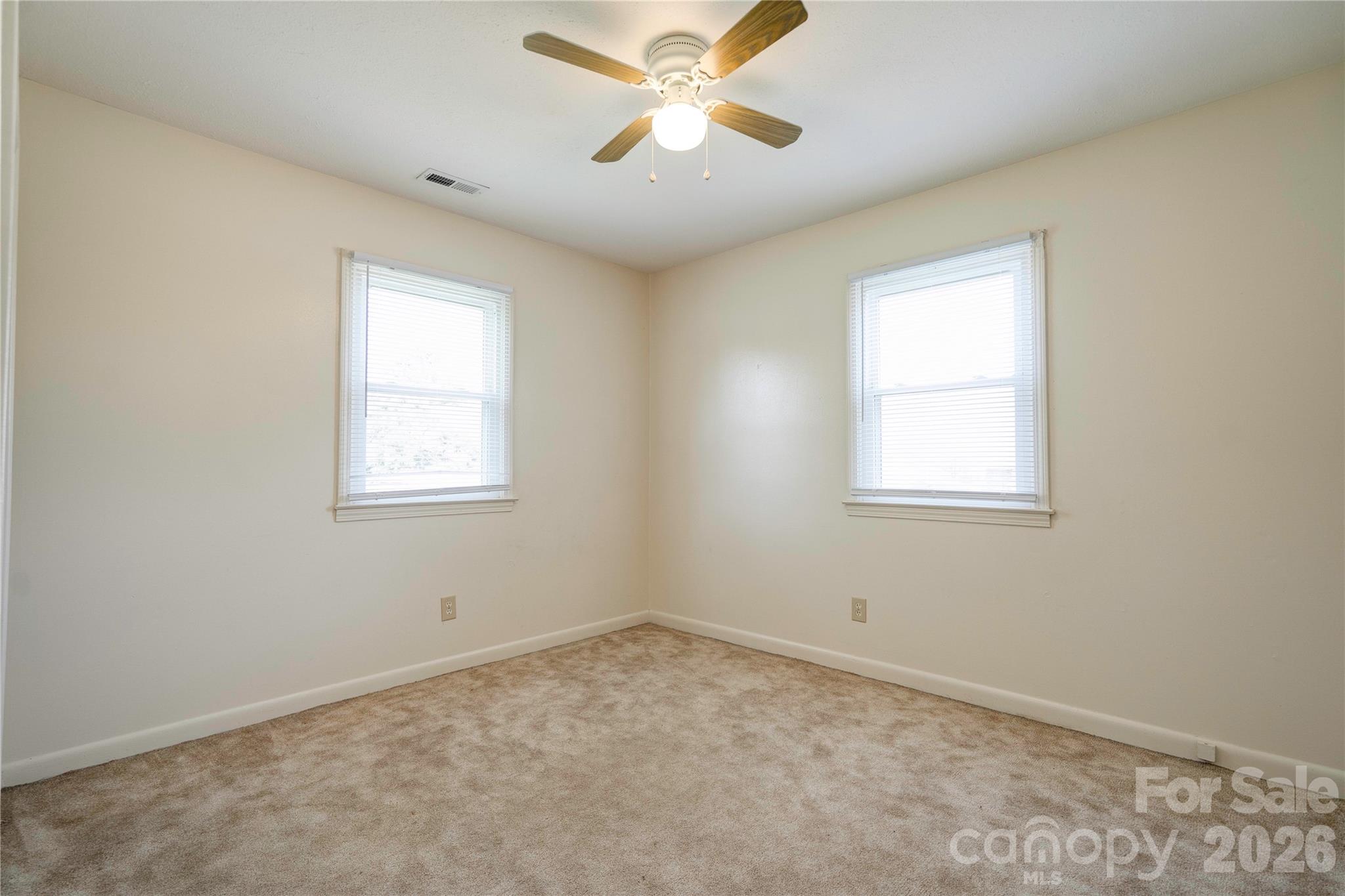 1904 Sulphur Springs Road Shelby, NC 28152 - Photo 18 of 27 an empty room with a window and a fan